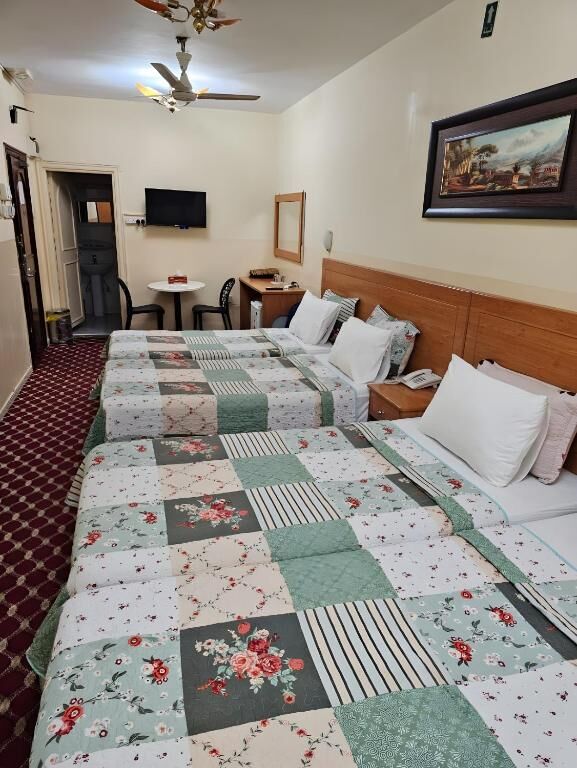 Classic Quadruple Room with four twin beds at Al Ahrar Hotel, Deira, Dubai